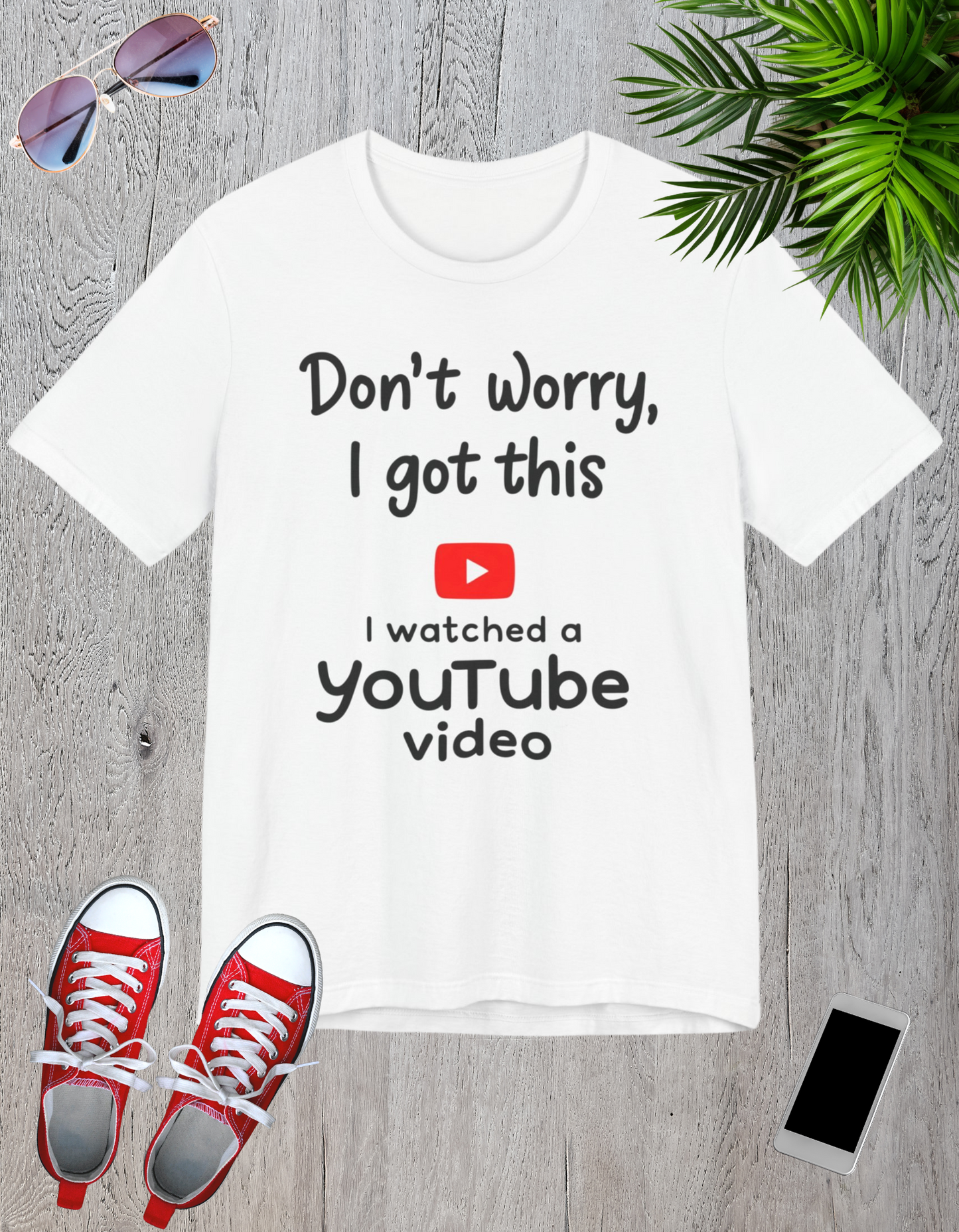 Black and white t-shirts featuring the text "Don't Worry, I Got This - I Watched a YouTube Video" with a playful YouTube logo graphic.