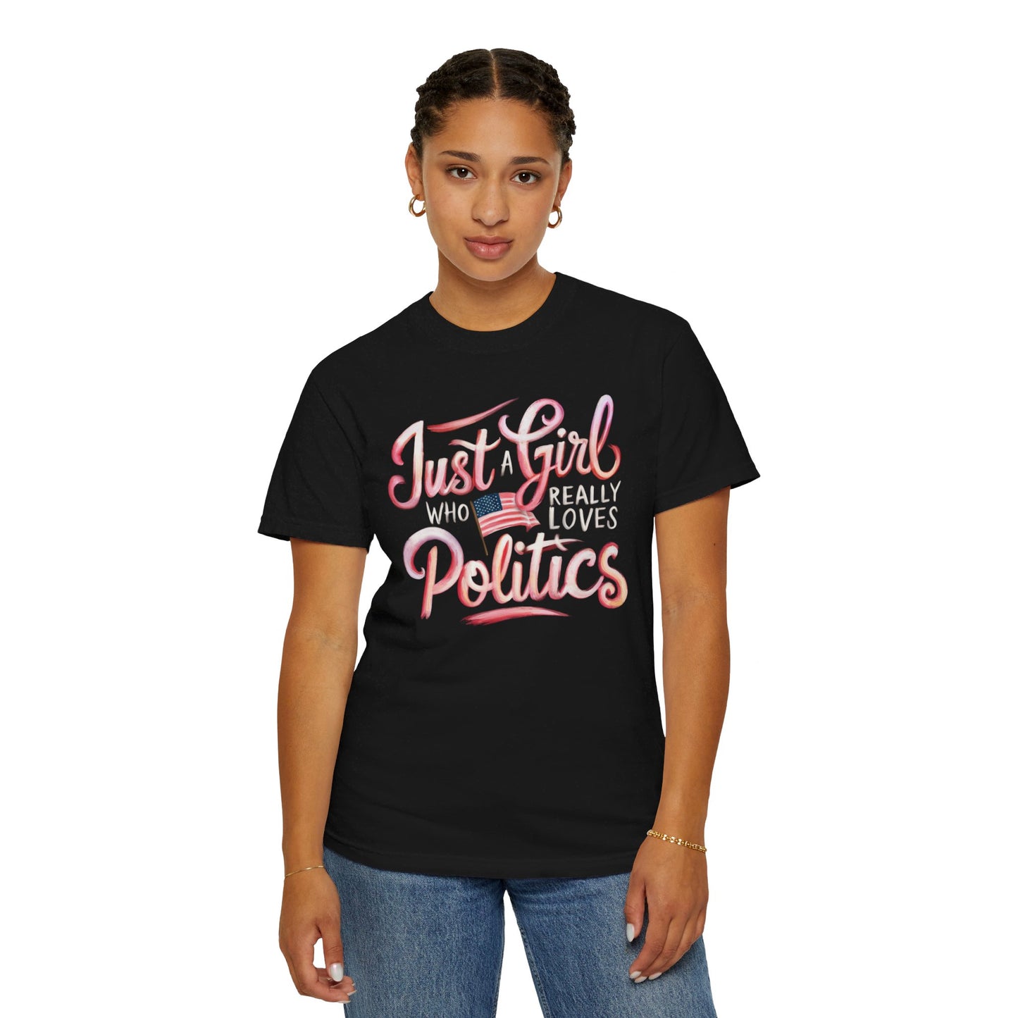 A black t-shirt with the text 'Just a Girl Who Really Loves Politics' in bold, white and pink lettering, featuring an American flag graphic.