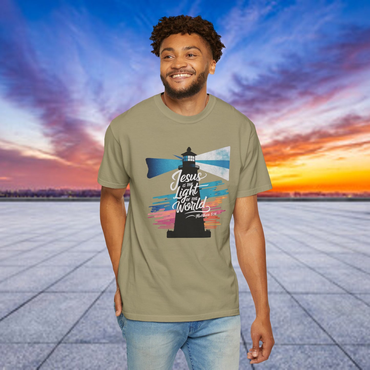 Inspirational "Jesus is the Light of the World" Christian graphic tee featuring a vibrant lighthouse design with colorful beams and a message from Matthew 5:14, perfect for expressing faith and spirituality with a vintage touch.