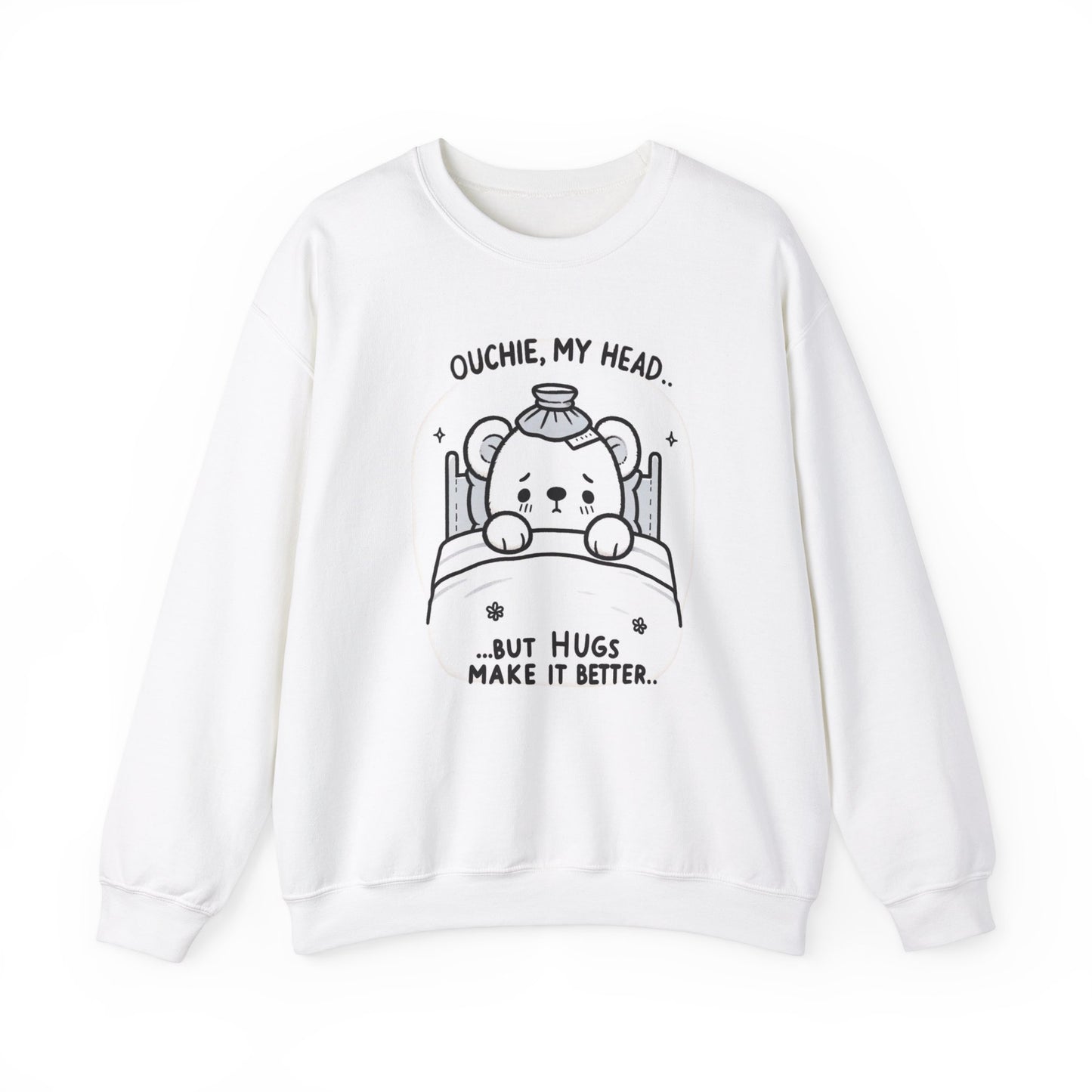 Cute white sweatshirt featuring a line-art illustration of a bear with a sore head, text above 'Ouchie, My Head,' and below 'But Hugs Make It Better.'