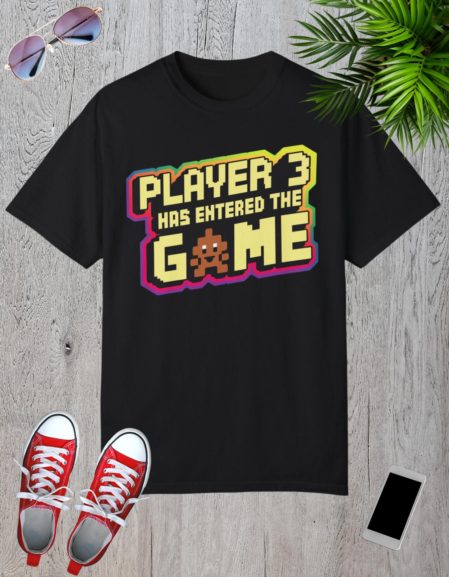 Multi-colored t-shirts featuring the text "Player 3 Has Entered the Game" in a retro gaming design.