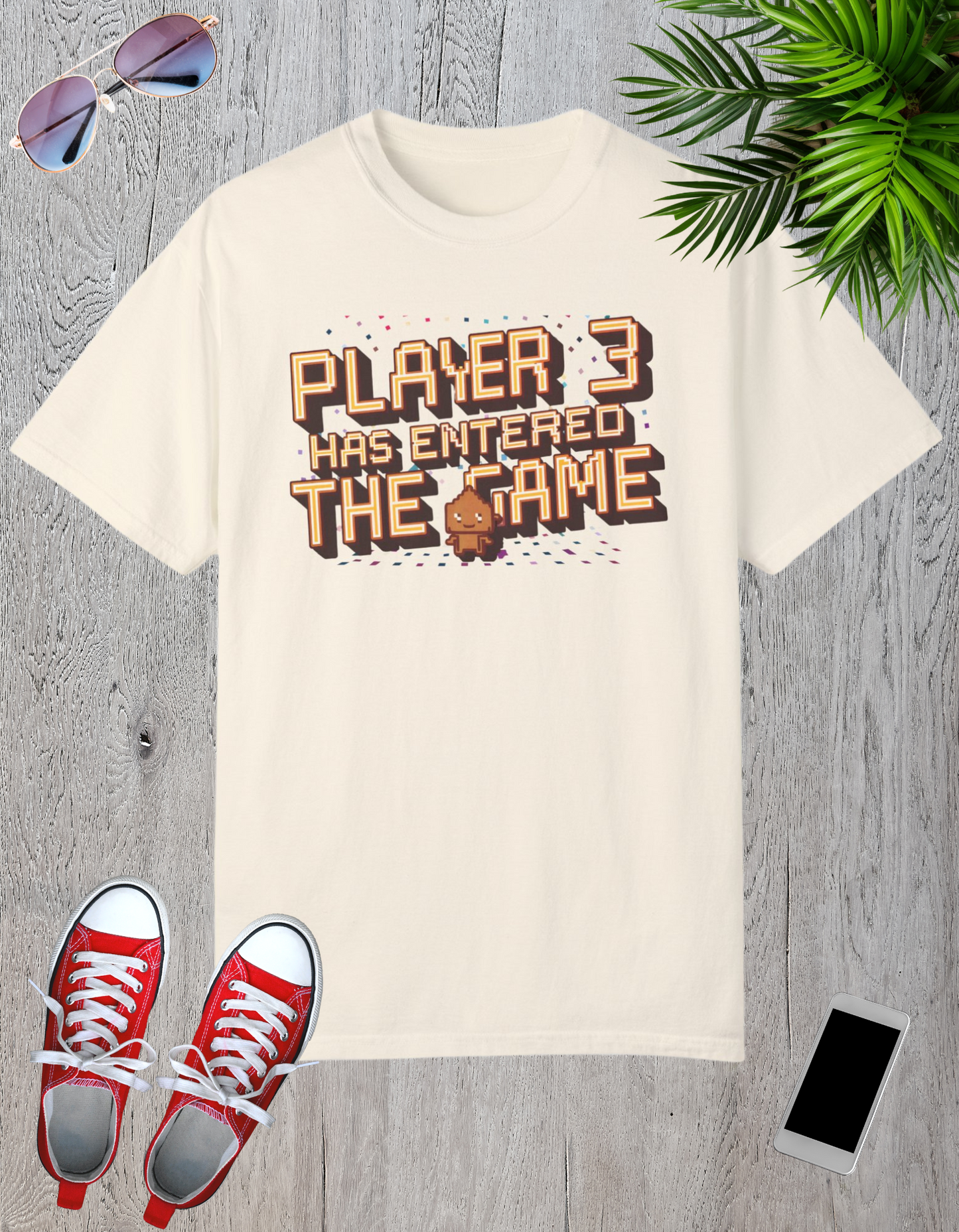 White and cream-colored t-shirts featuring the text "Player 3 Has Entered the Game" in a retro gaming design.