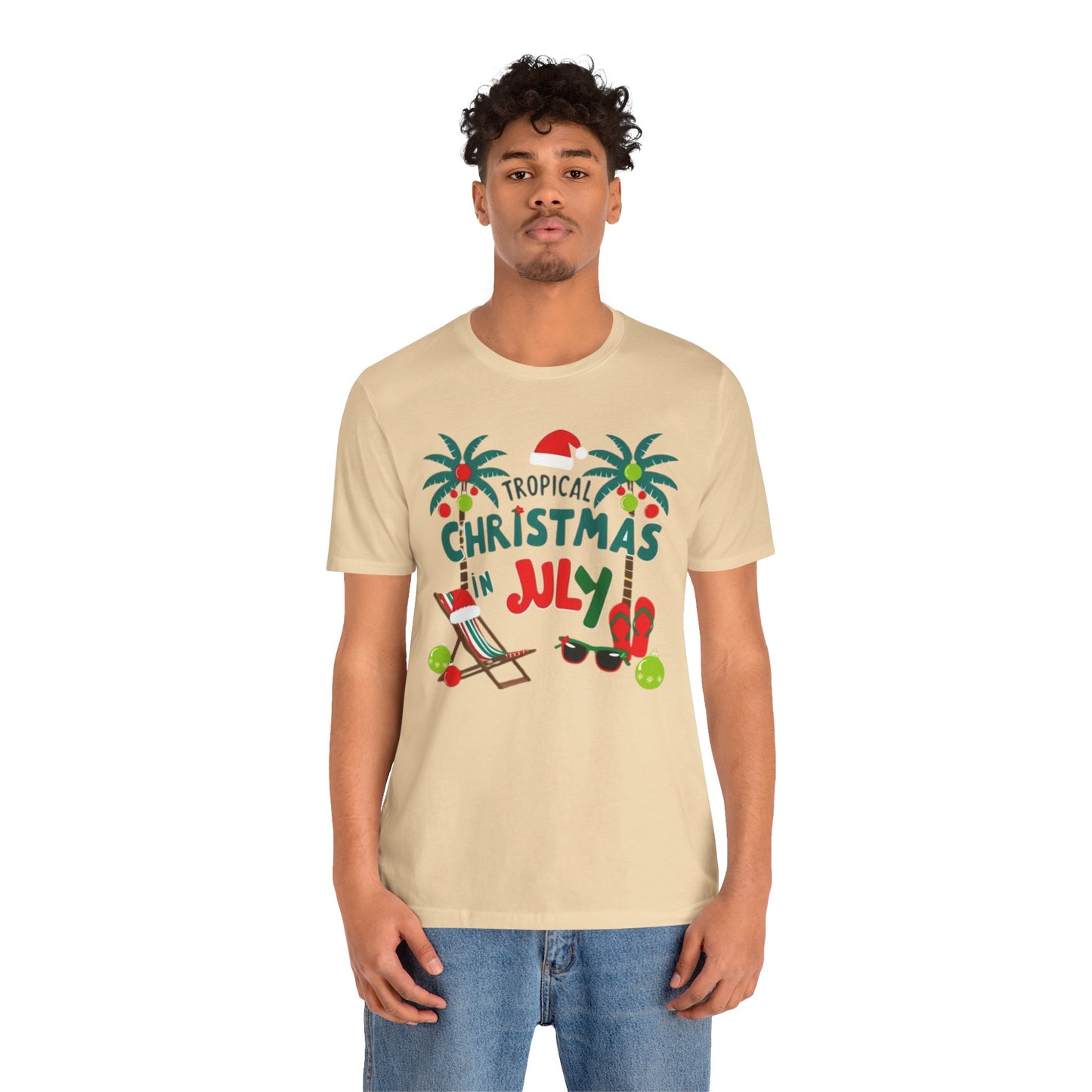 Tropical-themed t-shirts featuring the text "Christmas in July" with festive elements like palm trees, beach chairs, and a Santa.