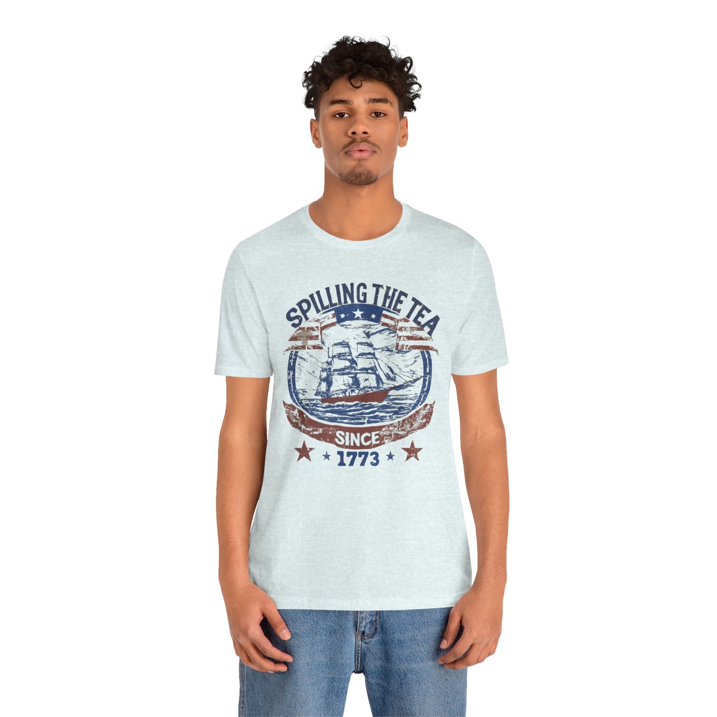 Various t-shirts featuring the text "Spilling the Tea Since 1773" with vintage-inspired graphics of ships and patriotic elements.