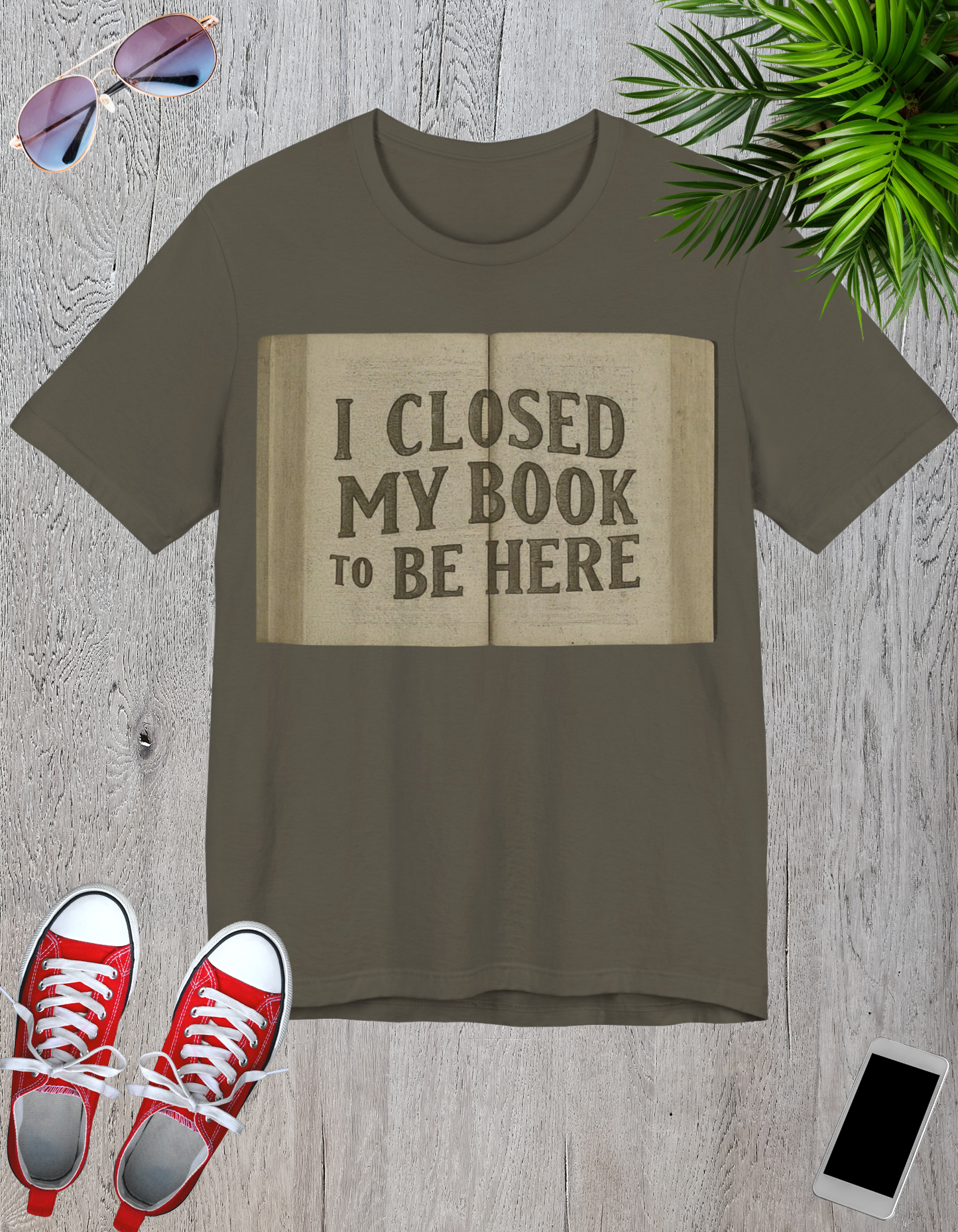 T-Shirts featuring the text "I Closed My Book to Be Here" with a fun book-themed design.