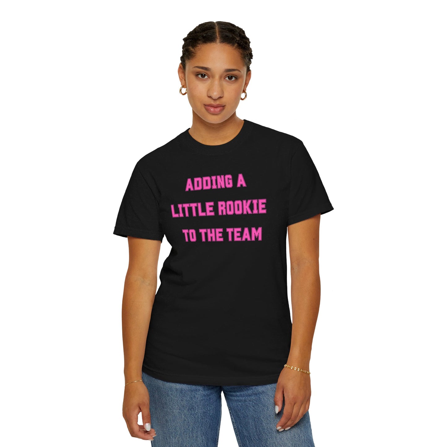 Black t-shirt with the text "Adding a Little Rookie to the Team" in a bold and playful font, available in blue, pink, and white.