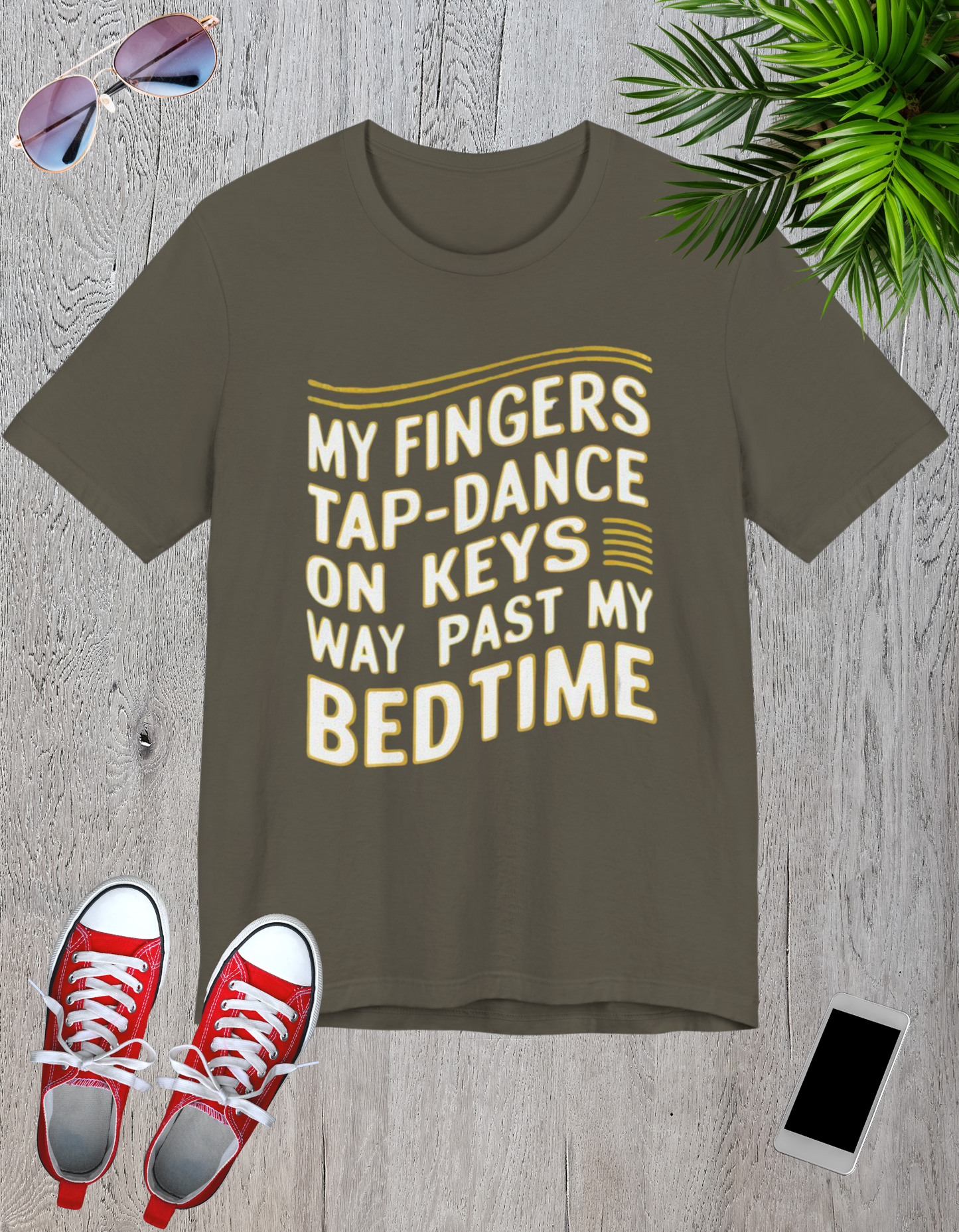 Graphic t-shirt with the text 'My Fingers Tap-Dance on Keys Way Past My Bedtime' in a wavy, fun font, perfect for night owls and creative professionals.