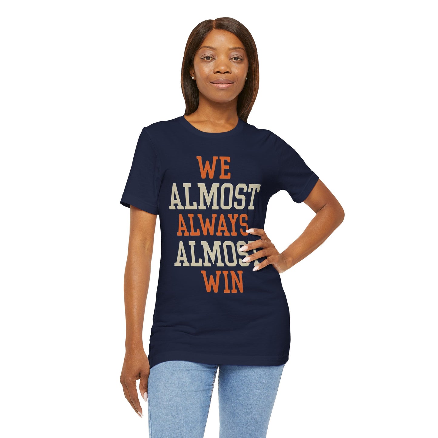 A stylish t-shirt with the motivational and humorous quote "We Almost Always Almost Win" printed in bold letters, perfect for sports enthusiasts and team players.