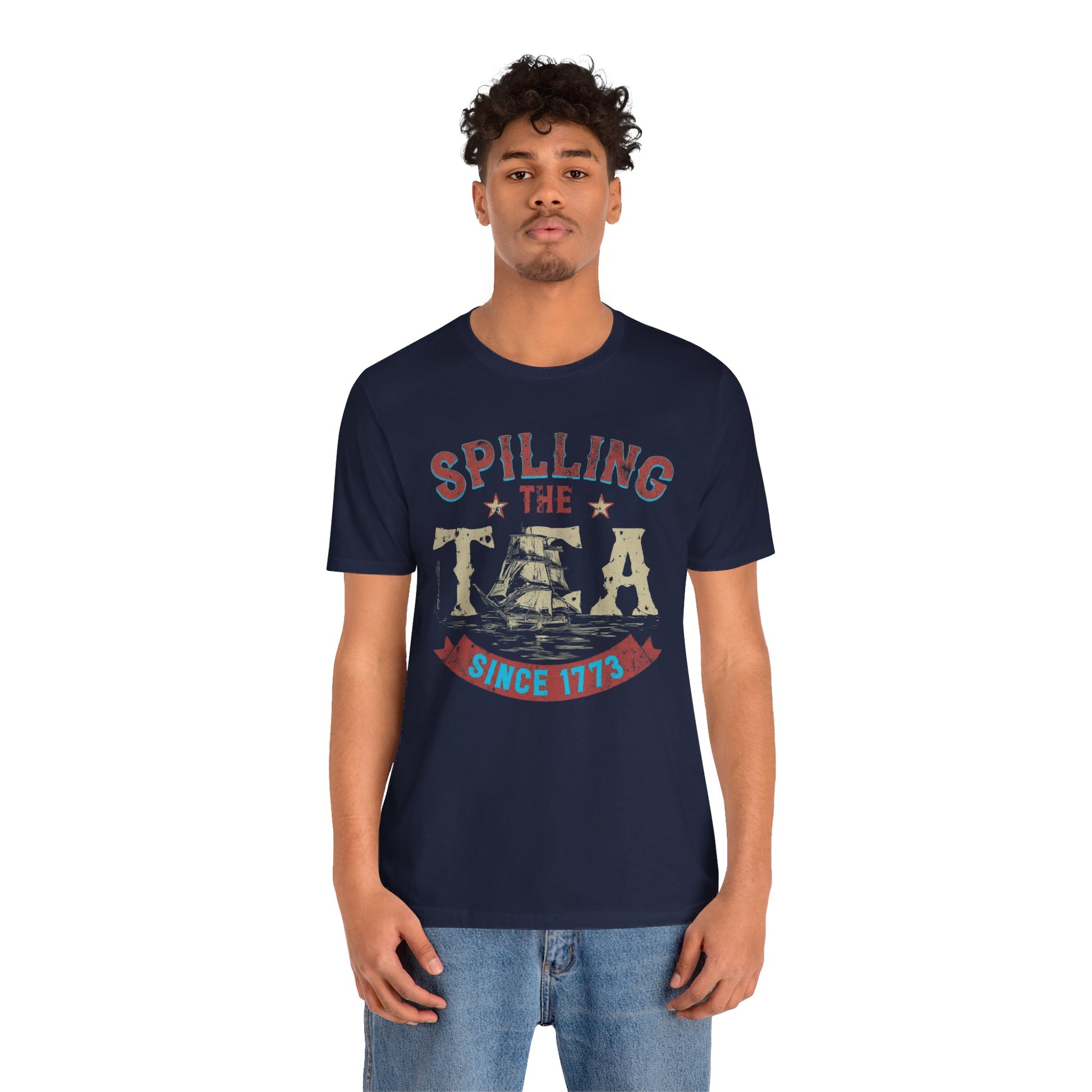 Various t-shirts featuring the text "Spilling the Tea Since 1773" with vintage-inspired graphics of ships and patriotic elements.