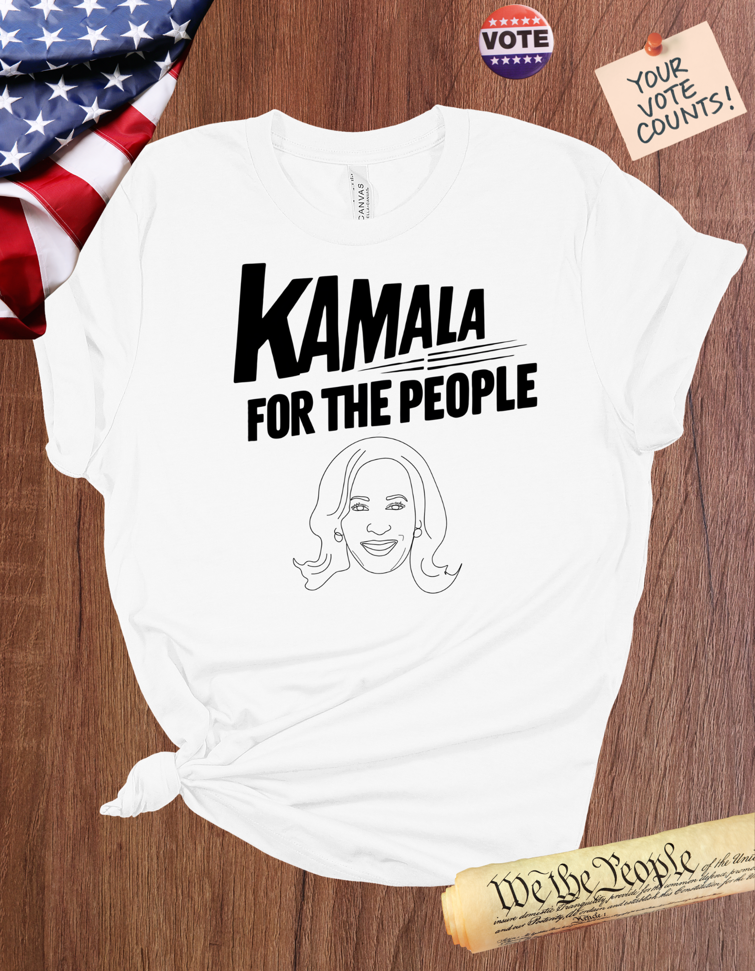 Kamala Harris 'For The People' graphic t-shirt featuring an illustration of Kamala Harris and a bold slogan.