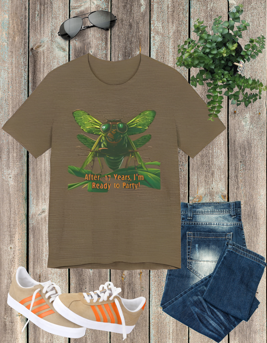 Unisex t-shirt featuring a cartoon cicada with sunglasses, captioned 'After 17 years I'm ready to party', designed for cicada lovers and bug enthusiasts.