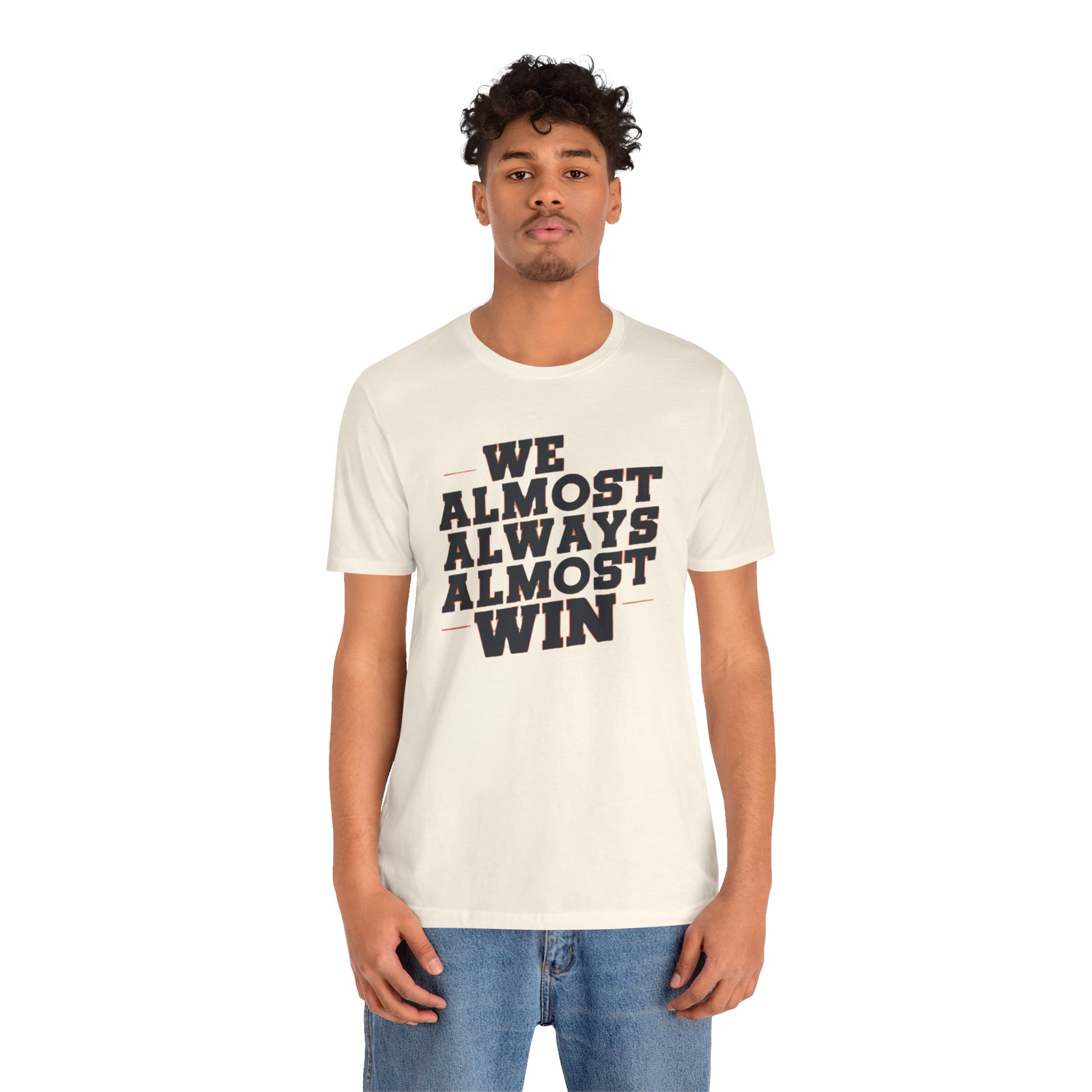 A stylish t-shirt with the motivational and humorous quote "We Almost Always Almost Win" printed in bold letters, perfect for sports enthusiasts and team players.