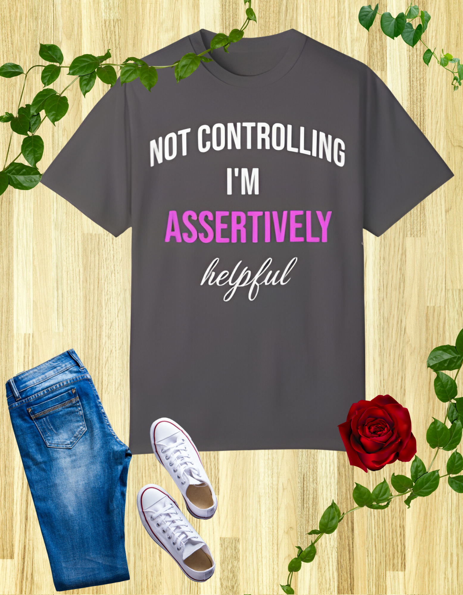 T-shirt with the words 'Not Controlling, I'm Assertively Helpful' in white and pink text.