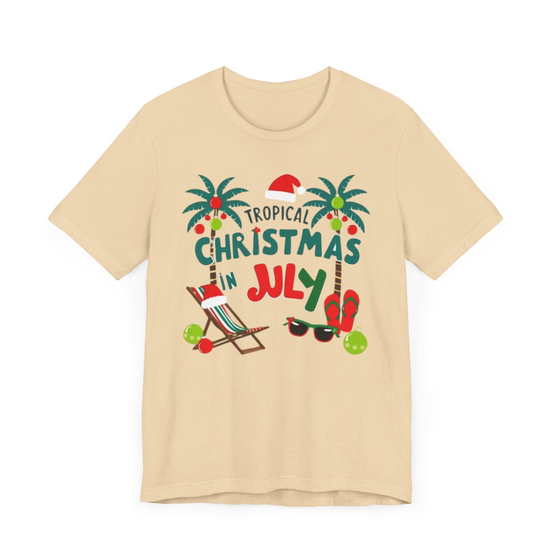 Tropical-themed t-shirts featuring the text "Christmas in July" with festive elements like palm trees, beach chairs, and a Santa.