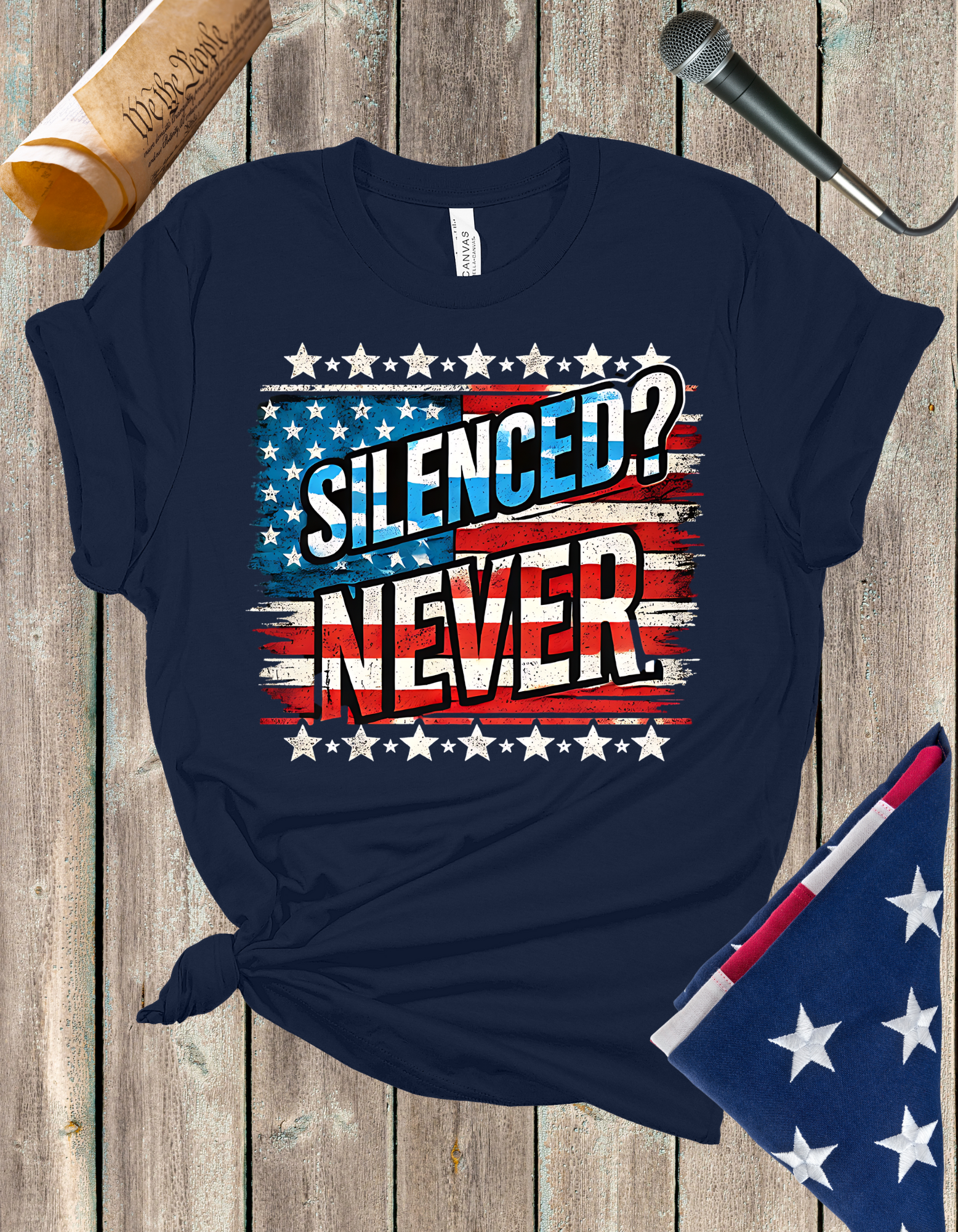 Silenced? Never. t-shirt with a distressed American flag background, featuring bold white text