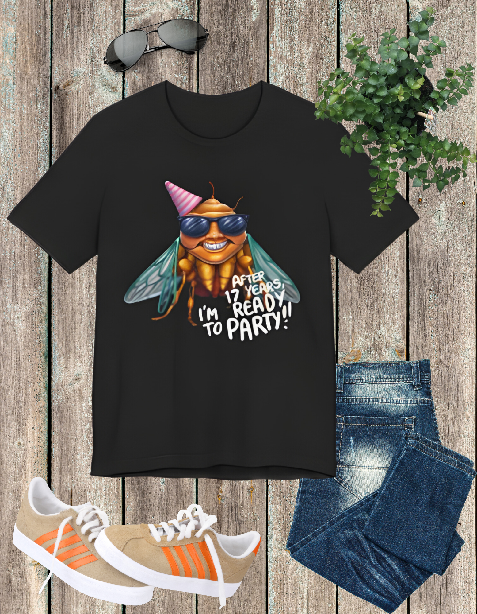 Unisex t-shirt featuring a cartoon cicada with sunglasses, captioned 'After 17 years I'm ready to party', designed for cicada lovers and bug enthusiasts.