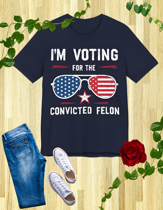 T-Shirts featuring the text "I'm Voting for the Convicted Felon" with patriotic American flag sunglasses design.