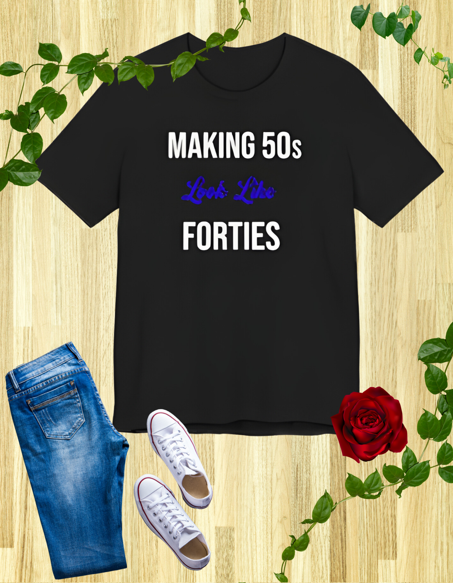 Black t-shirt with the text "Making 50s Look Like 40s" in bold letters, emphasizing a youthful spirit.