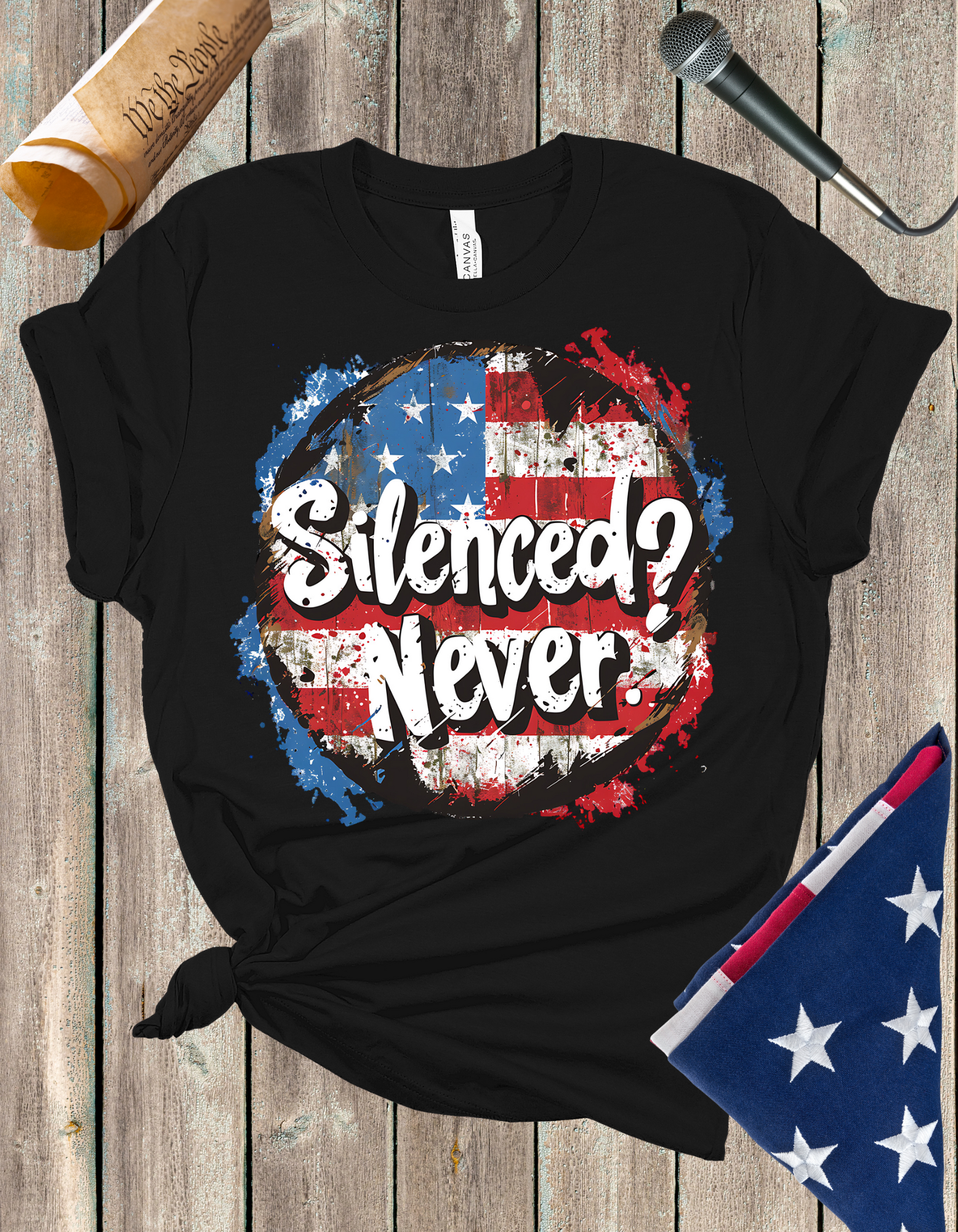 Silenced? Never. t-shirt with a distressed American flag background, featuring bold white text