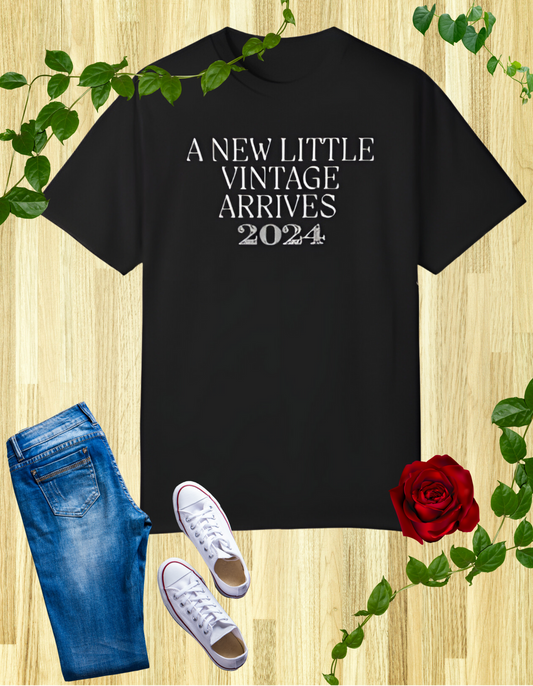 Black t-shirt with the text "A New Little Vintage Arrives 2024" in a classic, vintage-inspired font.