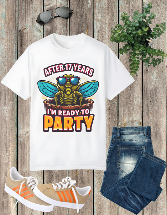 Unisex t-shirt featuring a cartoon cicada with sunglasses, captioned 'After 17 years I'm ready to party', designed for cicada lovers and bug enthusiasts.