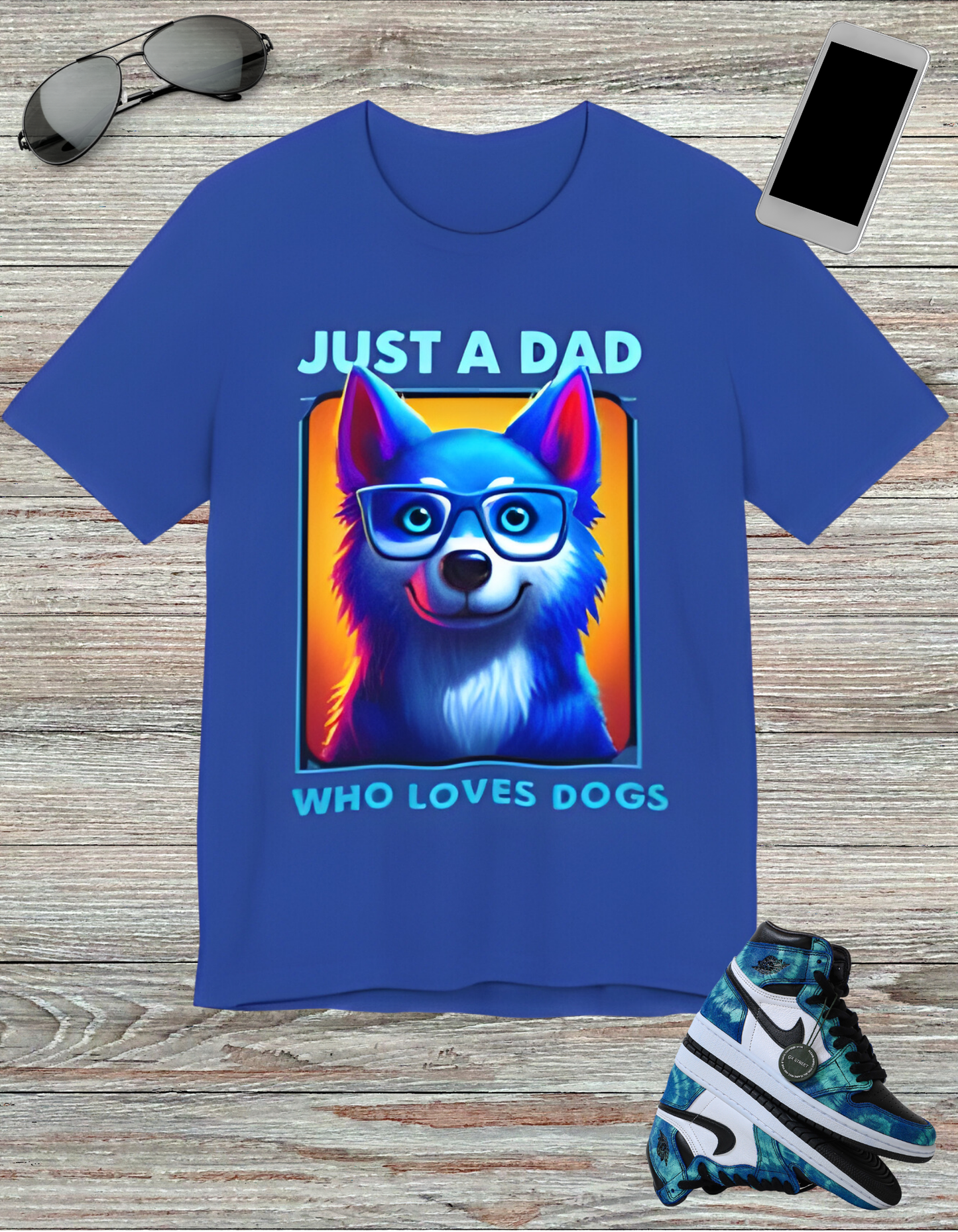 T-shirt featuring a vibrant and colorful graphic of a dog wearing glasses, with the text "Just a Dad Who Loves Dogs" prominently displayed. Perfect for dog dads and Father's Day gifts.