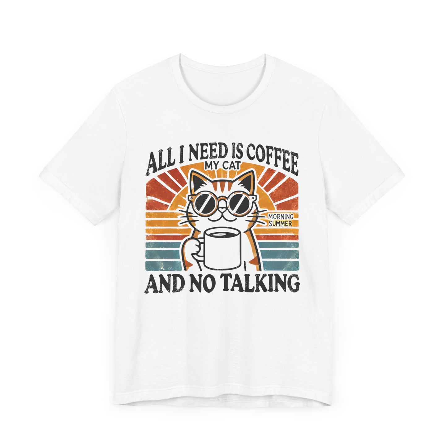 A light-colored t-shirt with a retro design of a cat wearing sunglasses, holding a coffee cup, and the text "All I Need is Coffee and My Cat.