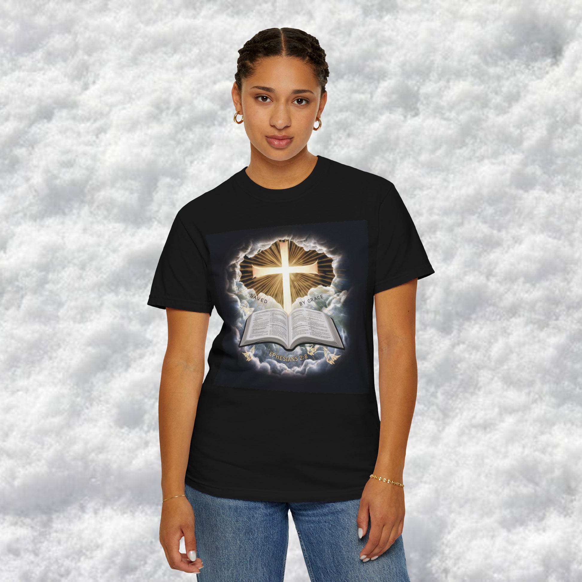 Divine "Saved by Grace" Christian graphic tee featuring a radiant cross emerging from the clouds and an open Bible with Ephesians 2:8, perfect for expressing faith and spirituality.