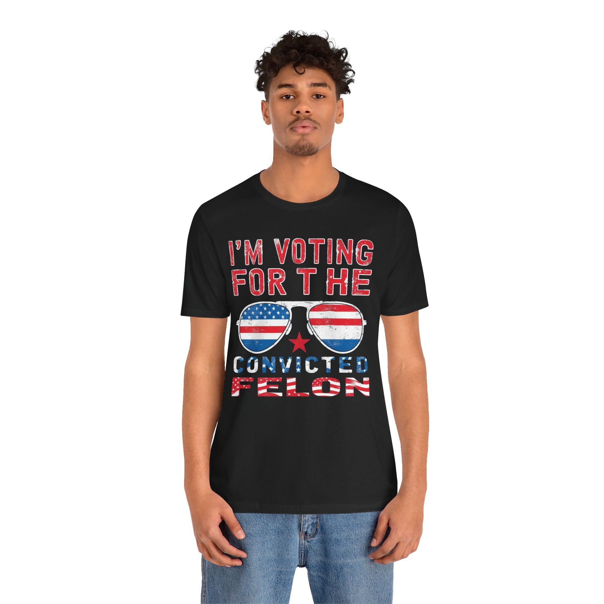 T-Shirts featuring the text "I'm Voting for the Convicted Felon" with patriotic American flag sunglasses design.