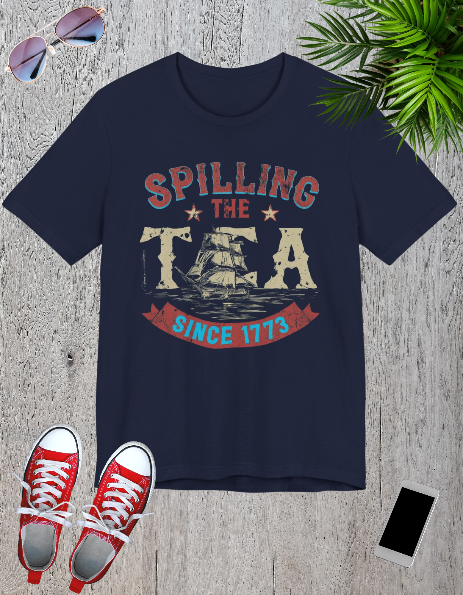 ps and patriotic eVarious t-shirts featuring the text "Spilling the Tea Since 1773" with vintage-inspired graphics of shilements.