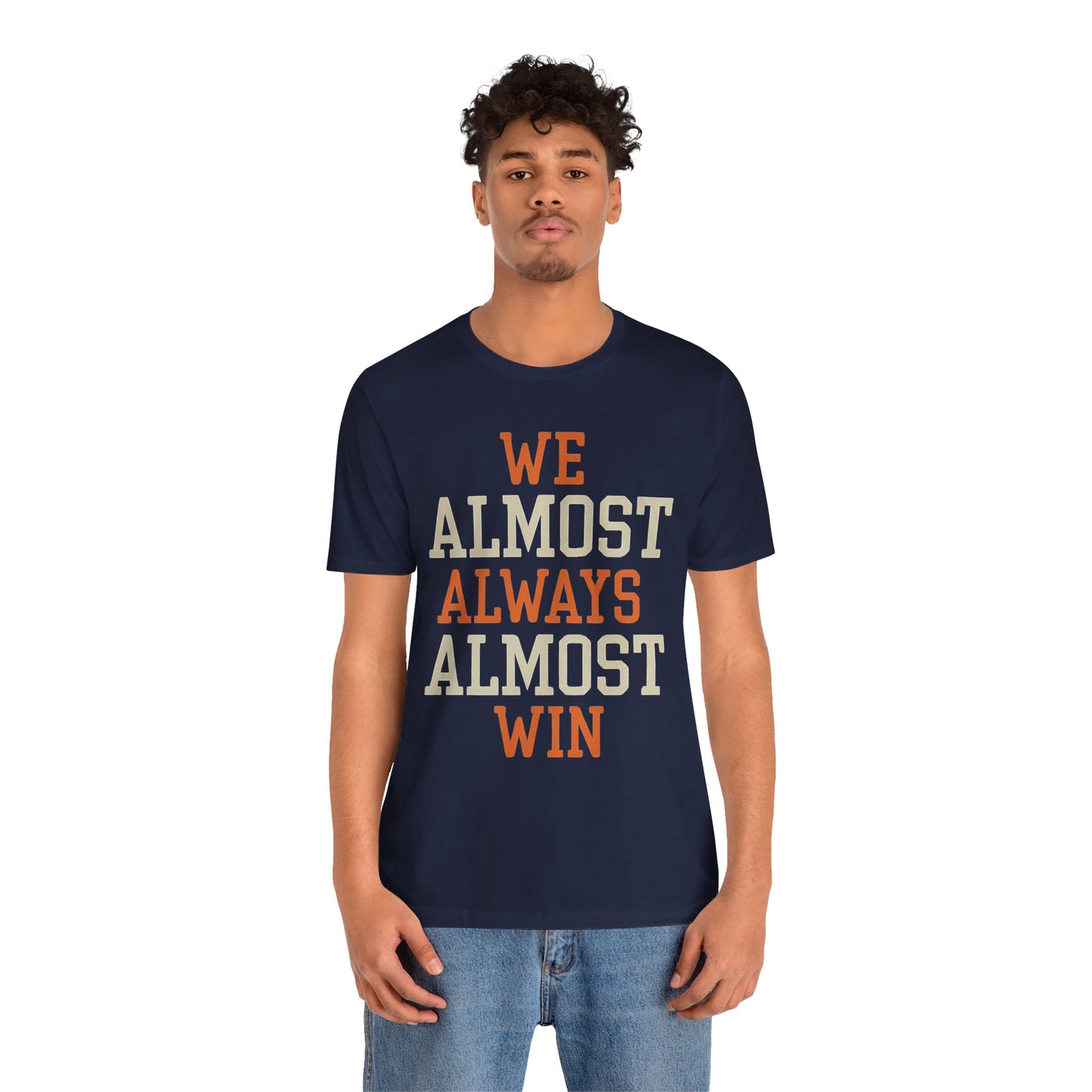 A stylish t-shirt with the motivational and humorous quote "We Almost Always Almost Win" printed in bold letters, perfect for sports enthusiasts and team players.