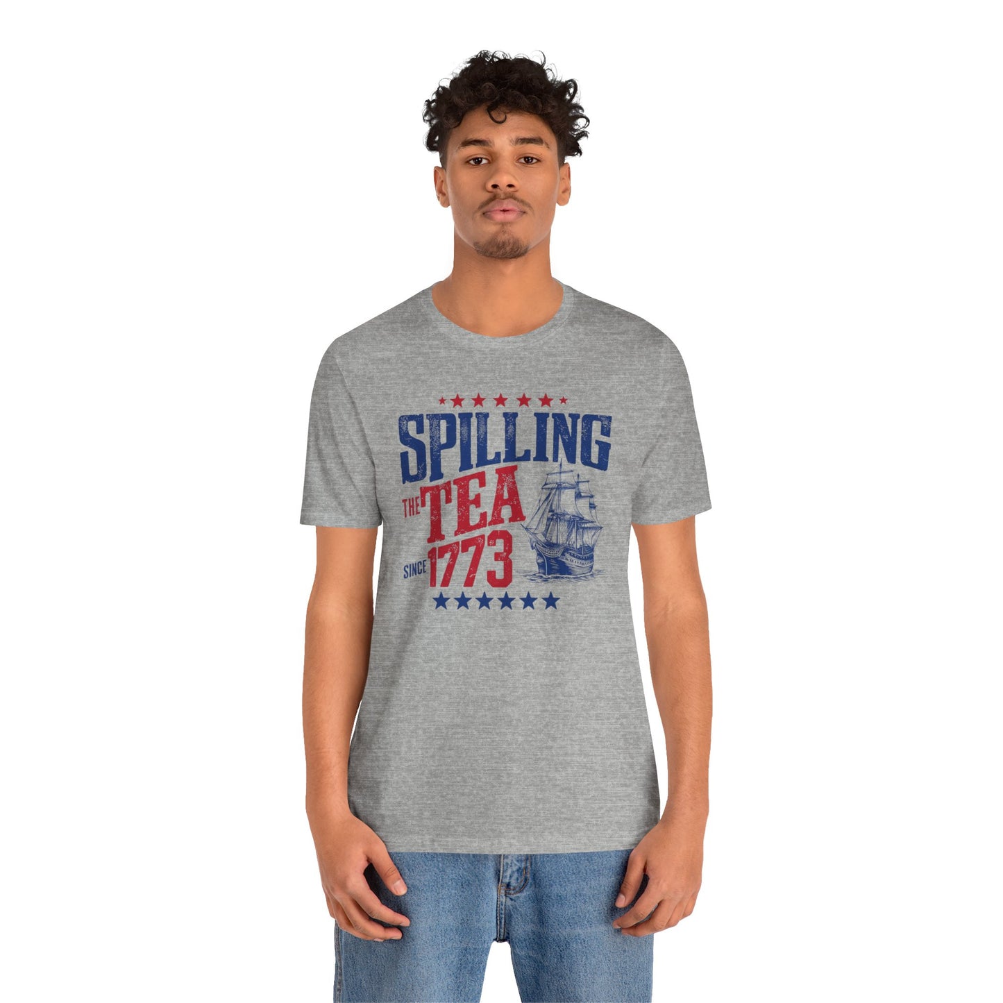 Various t-shirts featuring the text "Spilling the Tea Since 1773" with vintage-inspired graphics of ships and patriotic elements.