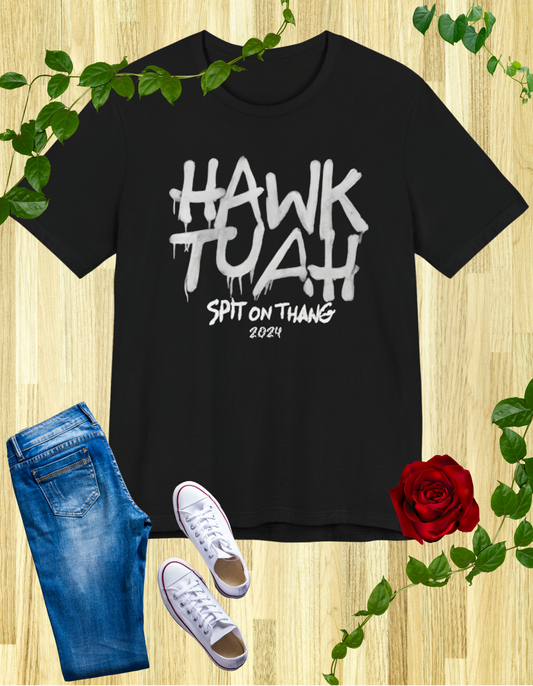 Black t-shirt with "HAWK TUAH SPIT ON THANG 2024" in graffiti-style font.