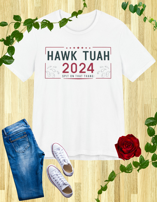 White t-shirt with "HAWK TUAH 2024 SPIT ON THAT THANG" in bold letters.